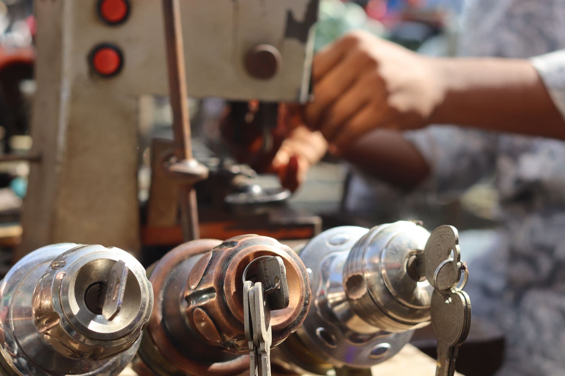 Hands cutting a key on a key machine