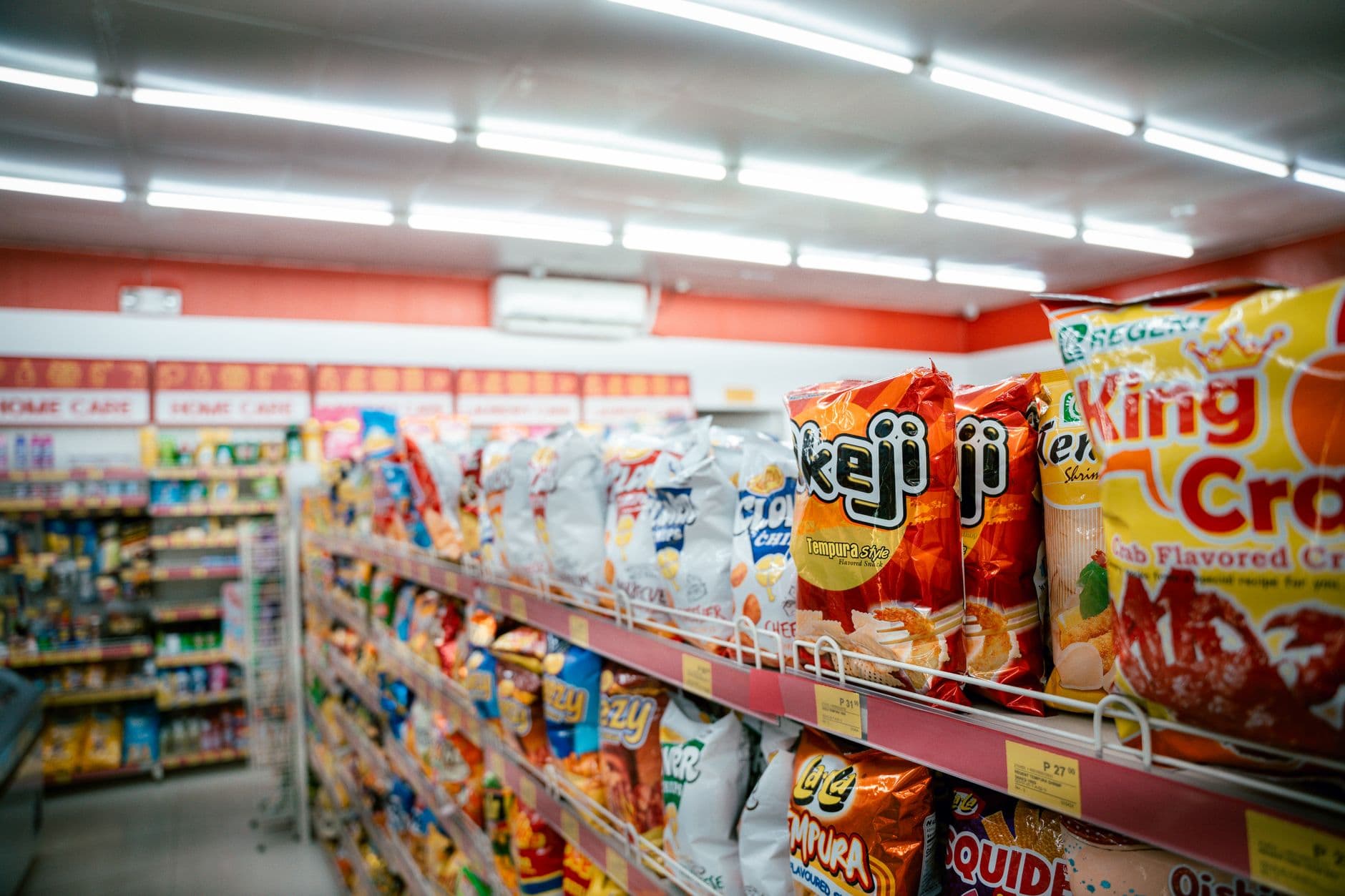 A convenience store aisle stocked with snacks